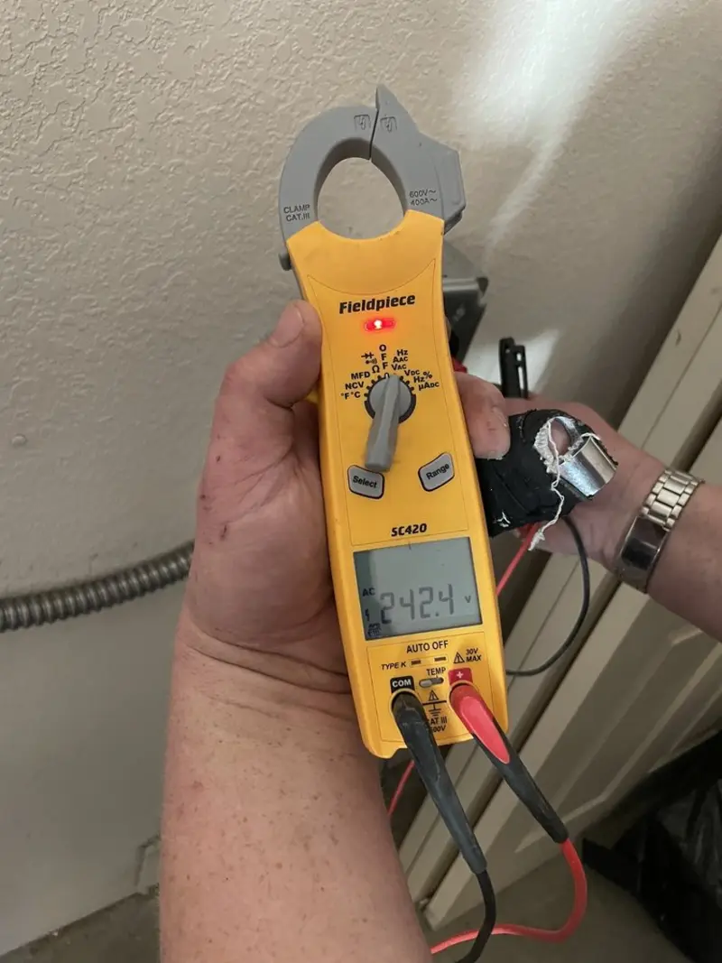 Voltage testing with clamp meter during Electrical Installation Services in Woodland